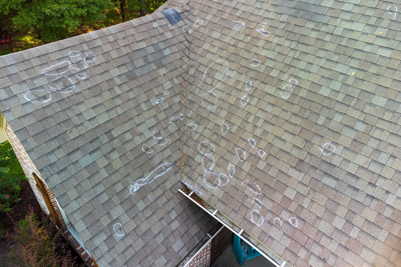 A shingle roof marked up for repair