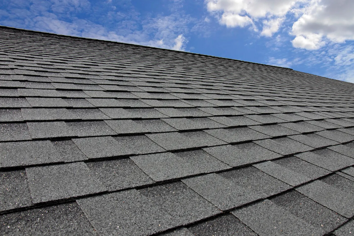 New architectural asphalt shingles on a pitched roof